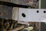 Close-up shot of Rust Buster Frame Shackle Mount Repair Kit for 1987-1995 Jeep Wrangler RB2004 installed to the frame