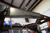 View from beneath the Rust Buster Over-Axle Frame Repair Kit For 1997-2003 Ford F-150 RB7002 installed to the frame rail