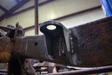 View from beneath the Rust Buster Front Cab Mount For 1997-2003 Ford F-150 RB7007 installed to the frame rail