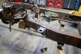 Wide angle, side view, of the Rust Buster Front Cab Mount For 1997-2003 Ford F-150 RB7007 installed to the frame rail