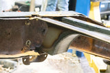 Close-up shot of the Rust Buster Fuel Tank Crossmember For 1997-2003 Ford F-150 RB7010 installed to one of the two frame rails