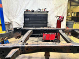 Wide angle of the Rust Buster Over-Axle Frame Repair Kit For 2009-2014 Ford F-150 RB7013 installed to the frame rail