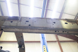 View from beneath the Rust Buster Mid Frame Repair Kit For 2009-2014 Ford F-150 RB7015 installed to the frame rail