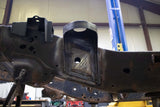 View from beneath the Rust Buster Rear Cab Mount For 2009-2014 Ford F-150 RB7019 installed to the frame rail