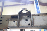 View from beneath the Rust Buster Center Cab Mount For 2009-2014 Ford F-150 RB7020 installed to the frame rail