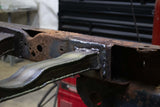 Close-up shot of the Rust Buster Rear Spare Tire Crossmember For 2009-2014 Ford F-150 RB7028 welded to the frame rail