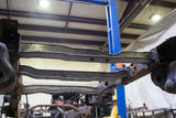 View from beneath the Rust Buster Rear Spare Tire Crossmember For 2009-2014 Ford F-150 RB7028 installed to the frame