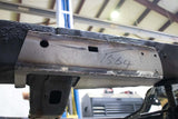 View beneath Rust Buster Center Frame Repair Kit for 2003-2015 Tacoma/4Runner RB7130 installed to the frame