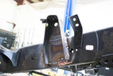 View beneath Rust Buster Front Bed Mount for 2005-2015 Toyota Tacoma RB7136 installed to frame