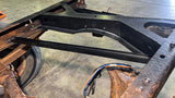 Wide angle of Rust Buster Spare Tire Rear Forward Crossmember Support For 1988-1998 C/K Trucks RB7332 bolted to the frame rail