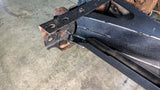 Close-up view of Rust Buster Spare Tire Rear Crossmember Support For 1988-1998 Chevy C/K Trucks RB7333 bolted to the frame rail