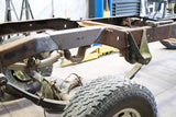 Full view of Rust Buster Over-Axle Frame Repair Kit For 1973-1987 Chevy K-Series RB7353 installed to the frame rail, with reference to the rest of the vehicle