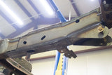 View from beneath Rust Buster Center Frame Repair Kit For 2007-2014 GM SUV's RB7426 installed to the frame rail