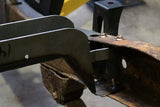 Close up angle of Rust Buster Fuel Tank Crossmember For 1994-2004 GM S10/Sonoma RB7609 bolted to the frame rail